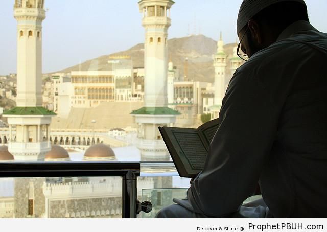 Man Reading Quran by Masjid al-Haram in Makkah, Saudi Arabia - al-Masjid al-Haram in Makkah, Saudi Arabia