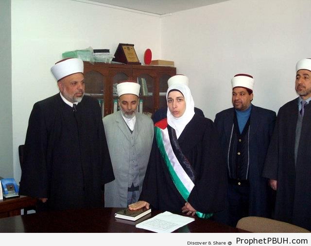 Asmahan al-Wahidi Being Sworn In as a Judge for the Shariah Court in Al-Khalil (Hebron), Palestine - Mushaf Photos (Books of Quran)